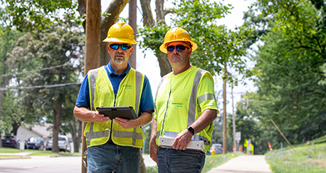 Consumers Energy crews installing secondary wire in Kalamazoo
